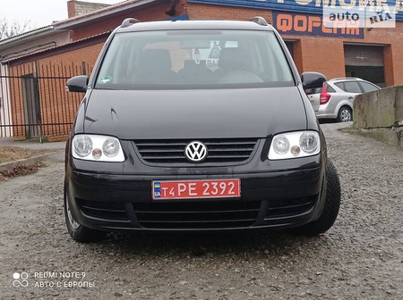 Volkswagen Touran 2006  випуску Херсон з двигуном 1.6 л бензин мінівен механіка за 6999 долл. 