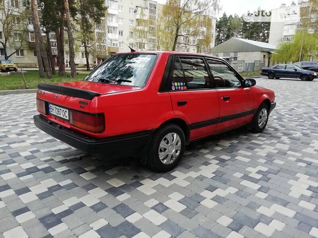 Mazda 323 1985  випуску Хмельницький з двигуном 1.5 л бензин седан механіка за 1250 долл. 